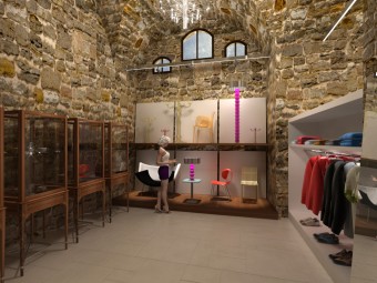 SECONDA SALA allestita con scaffali, vetrine e ripiani.